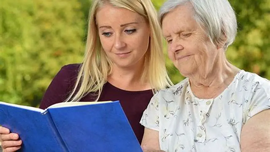 Senior woman solving large-print sudoku at home
