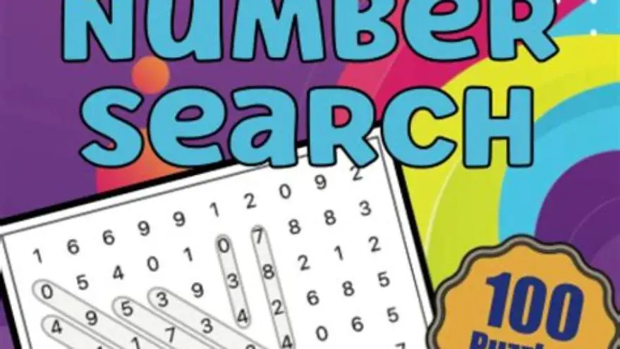 Senior reading large-print puzzle book with magnifying glass on table